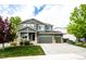 Charming two-story home with a three-car garage and an inviting covered porch at 5550 Fox Meadow Ave, Highlands Ranch, CO 80130
