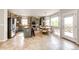 Bright kitchen featuring an island, stainless steel appliances, a breakfast nook, and a door to the deck at 5550 Fox Meadow Ave, Highlands Ranch, CO 80130