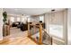 View of the open living space from the stairwell, showcasing the cozy and stylish furniture at 5550 Fox Meadow Ave, Highlands Ranch, CO 80130