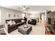Bright living room showcasing neutral walls, ceiling fan, plush seating, and stylish decor elements at 5550 Fox Meadow Ave, Highlands Ranch, CO 80130