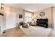 Comfortable living room featuring an upright piano, neutral furniture, and ample natural light at 5550 Fox Meadow Ave, Highlands Ranch, CO 80130