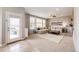 Bright living room with large windows, comfortable seating, and access to the outdoor deck at 5550 Fox Meadow Ave, Highlands Ranch, CO 80130