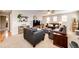 Inviting living area features plush seating, stylish decor, and a warm, neutral color palette at 5550 Fox Meadow Ave, Highlands Ranch, CO 80130