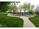 Beautiful community park with playground, picnic tables, and lush green space for residents to enjoy at 5550 Fox Meadow Ave, Highlands Ranch, CO 80130
