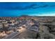 Aerial view shows the community streetscape with distant mountain butte at 2957 Eagle Wing Way, Castle Rock, CO 80109