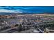 Night aerial showcases the community with playground, winding roads and city lights in the distance at 2957 Eagle Wing Way, Castle Rock, CO 80109