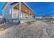 Inviting backyard with a covered patio, manicured lawn, and irrigation system at 2957 Eagle Wing Way, Castle Rock, CO 80109