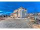 Beautiful backyard featuring a covered patio, lush lawn, and tasteful landscaping at 2957 Eagle Wing Way, Castle Rock, CO 80109