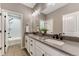 Beautiful bathroom with double vanity, modern sinks, neutral countertop and a view to the shower at 2957 Eagle Wing Way, Castle Rock, CO 80109