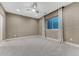 Bedroom featuring carpet, natural light through windows and a view to finished basement area at 2957 Eagle Wing Way, Castle Rock, CO 80109