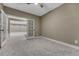 Carpeted bedroom showing French doors with access to the finished basement area at 2957 Eagle Wing Way, Castle Rock, CO 80109