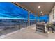 Spacious covered patio with great views and comfortable outdoor furniture at 2957 Eagle Wing Way, Castle Rock, CO 80109