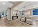 Elegant dining room featuring hardwood floors, neutral tones, modern lighting, and large windows at 2957 Eagle Wing Way, Castle Rock, CO 80109