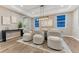 Chic dining room with wood floors, stylish seating, modern chandelier, and bright windows at 2957 Eagle Wing Way, Castle Rock, CO 80109