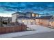 Two-story home with a three-car garage, manicured landscaping, and architectural stone accents at 2957 Eagle Wing Way, Castle Rock, CO 80109