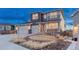 Stunning two-story home featuring stone accents, a two-car garage, and an inviting front yard at 2957 Eagle Wing Way, Castle Rock, CO 80109