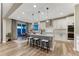 Modern kitchen with white cabinets, stainless steel appliances, eat-in island, and a dining nook at 2957 Eagle Wing Way, Castle Rock, CO 80109