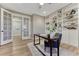 Bright home office featuring custom built-in shelving, double doors and an inviting work space at 2957 Eagle Wing Way, Castle Rock, CO 80109