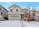 Charming two-story home showcasing a well-maintained lawn, garage, and inviting entryway at 2965 Deerfoot Way, Castle Rock, CO 80109