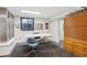 Finished basement office with a statement table, unique ceiling, and ample lighting at 1913 Five Iron Dr, Castle Rock, CO 80104