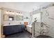 Stunning bathroom with marble-style tile, a glass-enclosed shower, and a soaking tub for ultimate relaxation at 1913 Five Iron Dr, Castle Rock, CO 80104