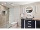 Finished bathroom with stand-up shower, stylish vanity, and unique lighting at 1913 Five Iron Dr, Castle Rock, CO 80104