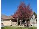 Charming single-Gathering home with a well-maintained lawn and beautiful flowering tree in a desirable neighborhood at 1913 Five Iron Dr, Castle Rock, CO 80104