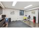 Home gym with exercise equipment, rubber flooring, and a mirrored wall at 1913 Five Iron Dr, Castle Rock, CO 80104