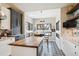 Eat-in kitchen with an island, breakfast bar, and views of the outdoors from plenty of windows at 1913 Five Iron Dr, Castle Rock, CO 80104