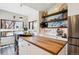 Open kitchen with a large island with storage, stainless appliances, and bright windows at 1913 Five Iron Dr, Castle Rock, CO 80104