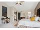 Comfortable bedroom featuring a large bed and natural light, a desk, and ensuite access at 1913 Five Iron Dr, Castle Rock, CO 80104