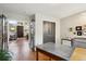 Spacious home office with French doors, blending into living area with natural light and wood floors at 1913 Five Iron Dr, Castle Rock, CO 80104