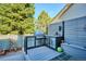 Contemporary outdoor kitchen with stainless steel grill, ample counter space, and custom storage cabinets on the deck at 1913 Five Iron Dr, Castle Rock, CO 80104