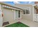 Exterior view of the rear patio with a doorway and awning at 2838 S Heather Gardens Way # A, Aurora, CO 80014