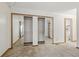 Bedroom closet with mirrored doors and full shelving at 2838 S Heather Gardens Way # A, Aurora, CO 80014