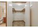 Walk-in closet featuring basic shelving providing ample space for storage and organization at 2838 S Heather Gardens Way # A, Aurora, CO 80014