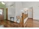 Bright entryway features hardwood floors and staircase at 2838 S Heather Gardens Way # A, Aurora, CO 80014