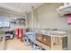 A dedicated kiln room with proper ventilation and shelving in a dedicated space for ceramic work at 2838 S Heather Gardens Way # A, Aurora, CO 80014
