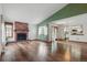 Bright living room with a beautiful fireplace, hardwood floors, and a large window at 2838 S Heather Gardens Way # A, Aurora, CO 80014