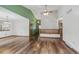 Open-concept living room with hardwood floors, high ceilings, and abundant natural light at 2838 S Heather Gardens Way # A, Aurora, CO 80014
