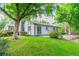Spacious backyard featuring a large lawn, mature trees, and well-maintained landscaping at 1248 Ilium Dr, Lafayette, CO 80026