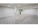 Spacious basement area with a stylish wet bar, plush carpet, and recessed lighting at 1248 Ilium Dr, Lafayette, CO 80026