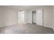 Bedroom featuring neutral carpet, white walls, closet and an en-suite bathroom at 1248 Ilium Dr, Lafayette, CO 80026