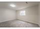 Finished bedroom with neutral carpet and paint, featuring a window and recessed lighting for a bright look at 1248 Ilium Dr, Lafayette, CO 80026