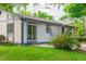 Home exterior features a sliding glass door to patio, neutral siding with blue trim, and well-maintained landscaping at 1248 Ilium Dr, Lafayette, CO 80026