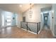 Spacious foyer with elegant lighting, modern railings and ample natural light at 1248 Ilium Dr, Lafayette, CO 80026
