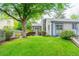Charming home with a well-manicured lawn and lovely landscaping, creating a welcoming curb appeal at 1248 Ilium Dr, Lafayette, CO 80026