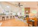 A light-filled living room with vaulted ceilings, a fireplace, and open access to a modern kitchen at 1248 Ilium Dr, Lafayette, CO 80026