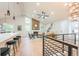 Bright open-concept living room with vaulted ceilings, a fireplace, and a kitchen with bar seating at 1248 Ilium Dr, Lafayette, CO 80026