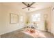 Well-lit office space featuring modern decor, plush carpets, and a ceiling fan at 1248 Ilium Dr, Lafayette, CO 80026
